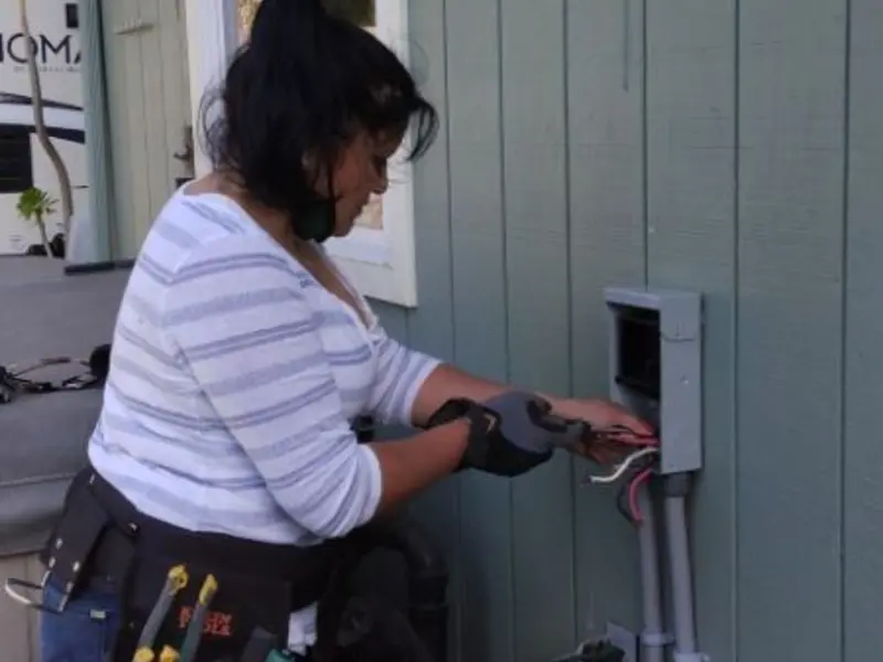 Licensed electrician wiring an exterior subpanel in Lake Isabella