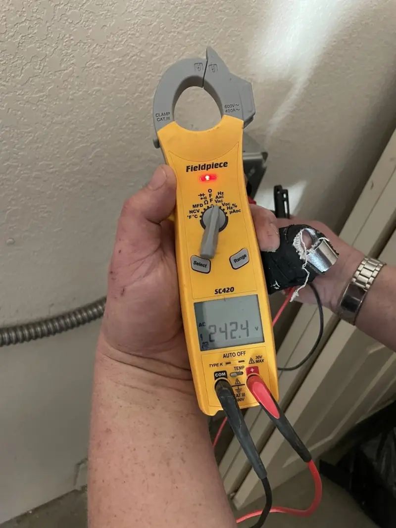 Voltage testing with clamp meter during Generator Installation in Lake Isabella